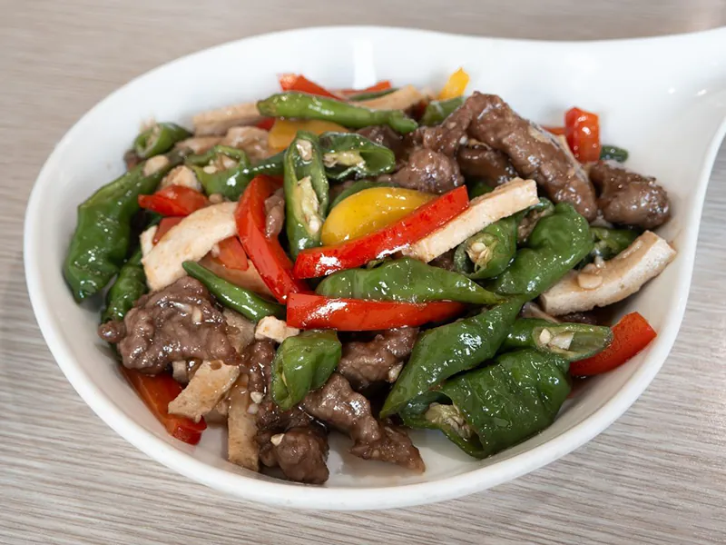 Sizzling stir-fried beef with green and red peppers at K Fusion Eats, an Asian restaurant in Sacramento.