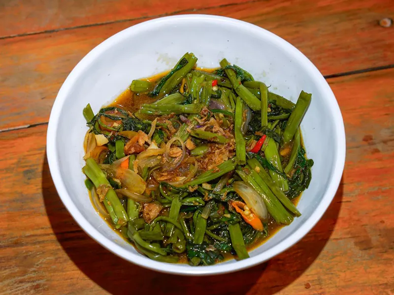 Vibrant stir-fried water spinach with garlic and chili at K Fusion Eats, an Asian restaurant in Sacramento.