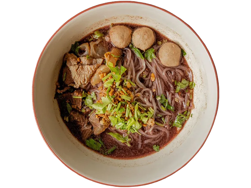 Hearty Thai beef ball noodle soup with herbs at K Fusion Eats, an Asian restaurant in Sacramento.